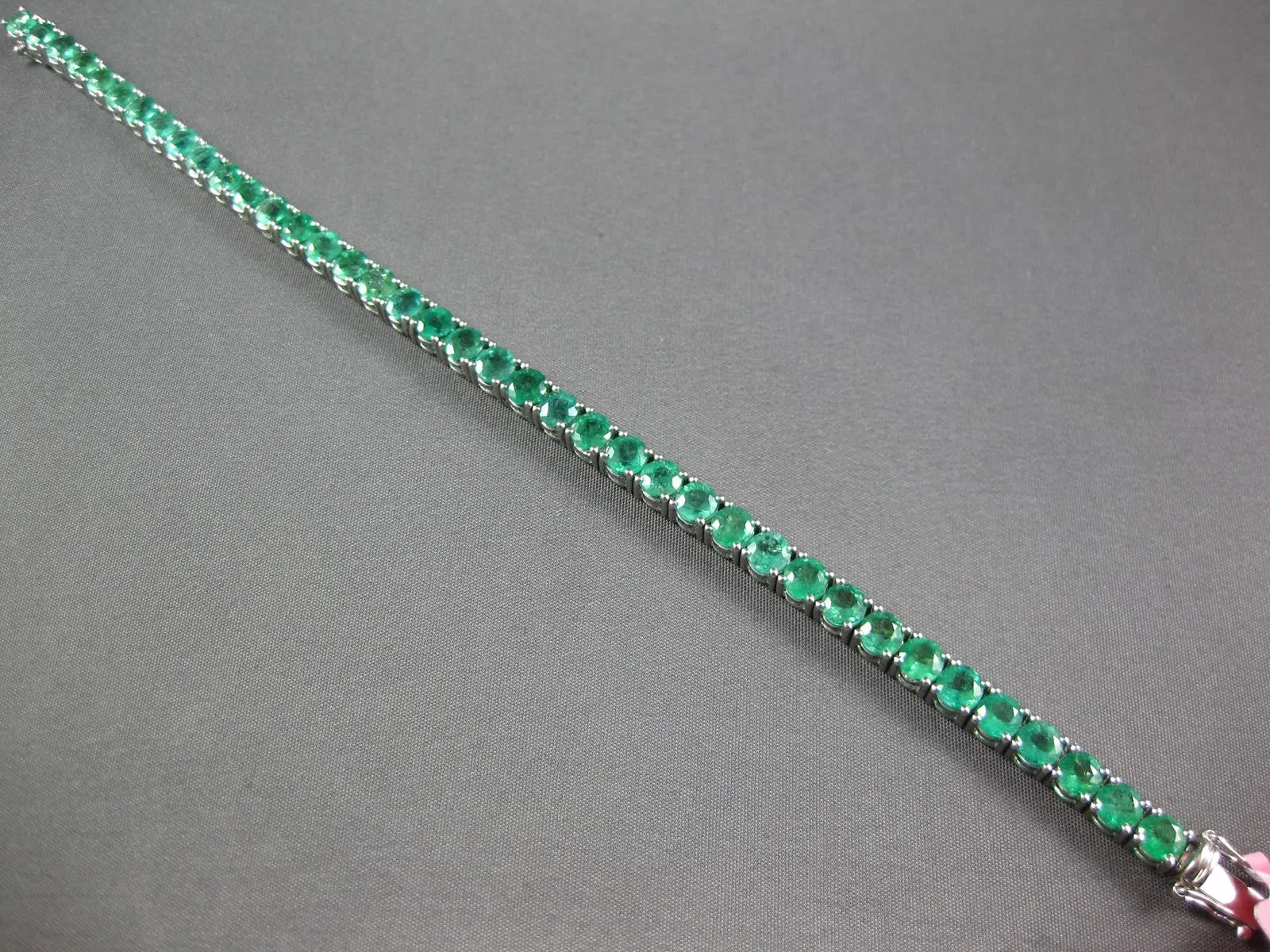 ESTATE LARGE 12.13CT AAA EMERALD 18KT WHITE GOLD 3D ROUND TENNIS BRACELET