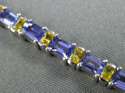 ESTATE WIDE 7.04CT TANZANITE & YELLOW SAPPHIRE 18KT WHITE GOLD TENNIS BRACELET