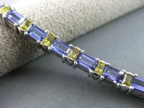 ESTATE WIDE 7.04CT TANZANITE & YELLOW SAPPHIRE 18KT WHITE GOLD TENNIS BRACELET