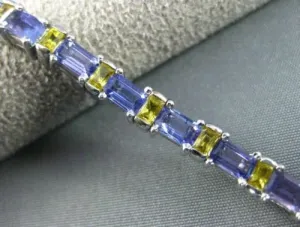 ESTATE WIDE 7.04CT TANZANITE & YELLOW SAPPHIRE 18KT WHITE GOLD TENNIS BRACELET