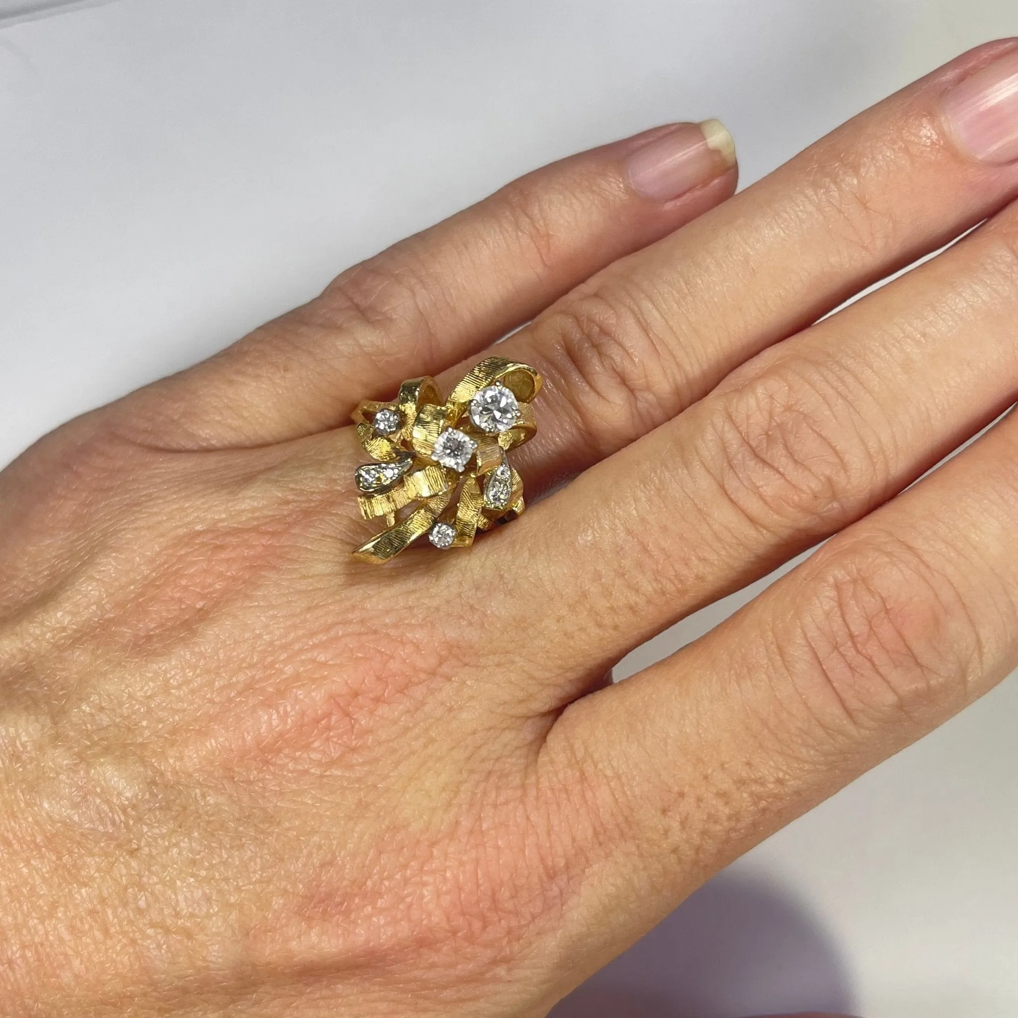 Vintage Diamond Cluster Ring with Old Hollywood Glamour. 14K Yellow Gold Setting with a Ribbon Design.